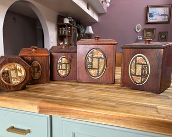 Vintage 1970s Wooden Canister Set and Napkin Holder with Oval Panels filled with embedded materials like dried grains 5 piece set