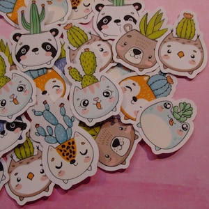 May include: A collection of colorful stickers featuring cute animal characters holding potted plants. The stickers are on a pink background and feature a variety of animals, including pandas, cats, owls, raccoons, and bears.