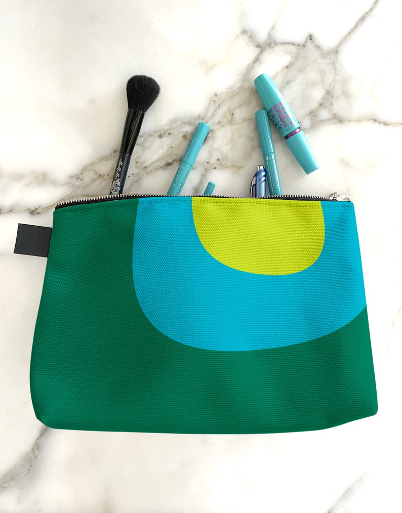 Retro cosmetics bag. A green and blue makeup bag with mid century, abstract print for cosmetics, toiletries, or accessories. Travel set image 2