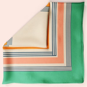May include: A square patterned silk scarf with a green border, orange, peach, and navy blue stripes.