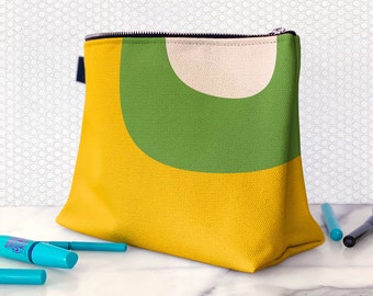 Green makeup bag in yellow and green. Mod cosmetic bag with retro abstract print. Canvas toiletries pouch for travel