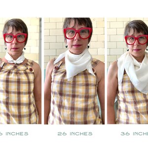 May include: Three images of a person wearing a white square scarf tied in a knot at the neck. The scarf is shown in three different lengths: 16 inches, 26 inches, and 36 inches.