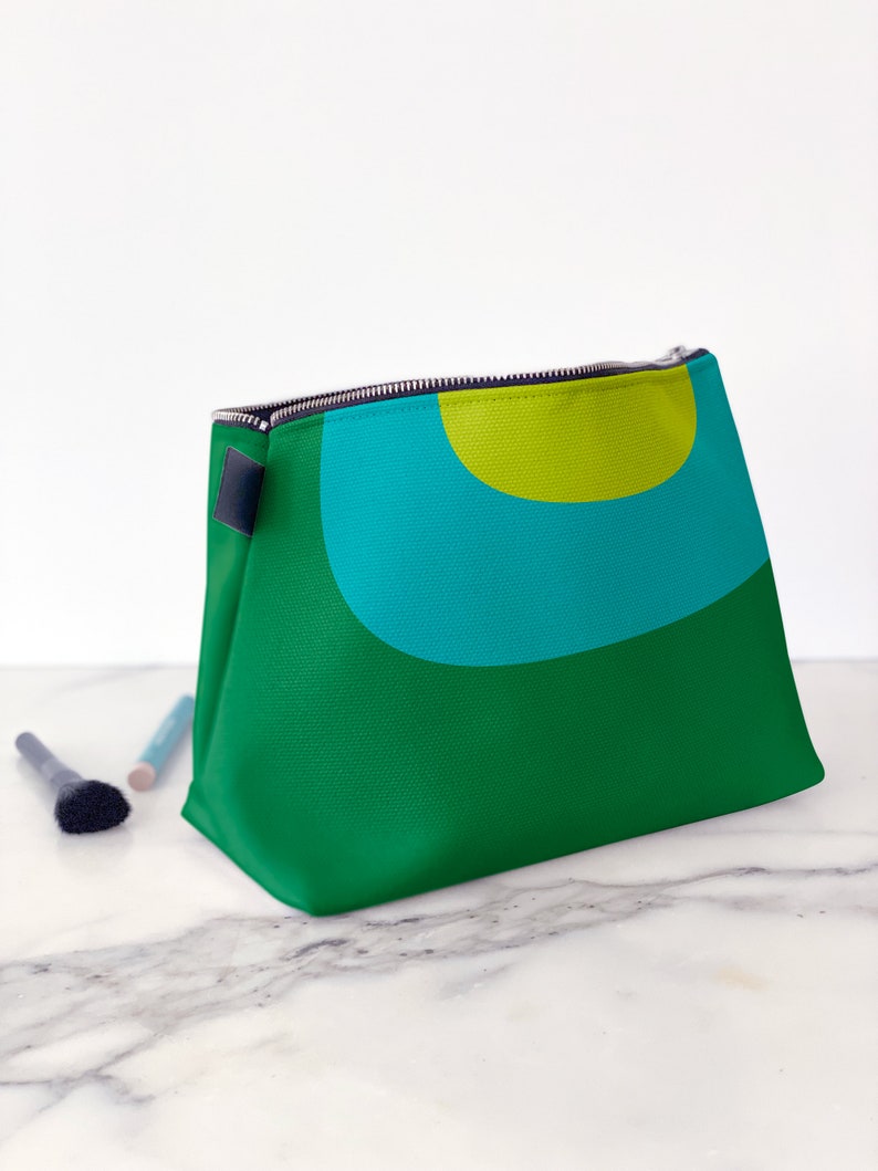 Retro cosmetics bag. A green and blue makeup bag with mid century, abstract print for cosmetics, toiletries, or accessories. Travel set image 6