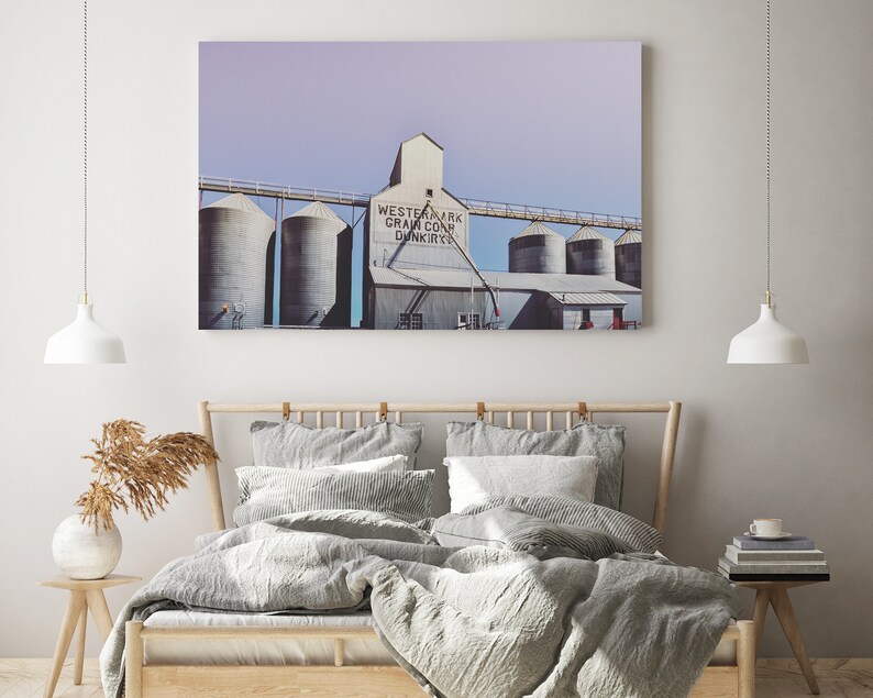 May include: A vintage photograph of a grain elevator with the text "Western Mark Grain Co. Dunkirk" on the side. The photo has a faded, vintage look and is printed on a canvas.