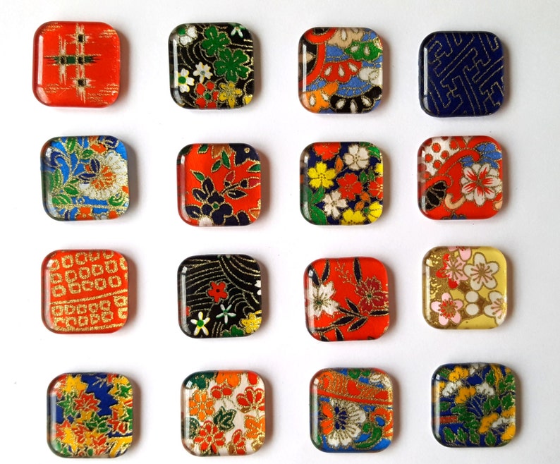 May include: A set of 15 square glass tiles with different colorful Japanese patterns. The tiles are approximately 1 inch by 1 inch.