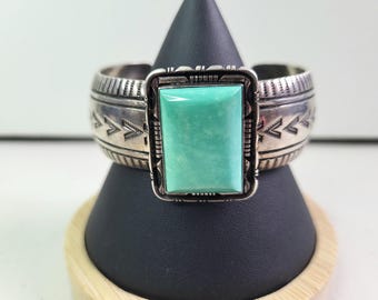 Navajo Sterling Silver Turquoise Cuff Bracelet. Stamped L.M.Y. (Larry Moses Yazzie). Square Cabochon.