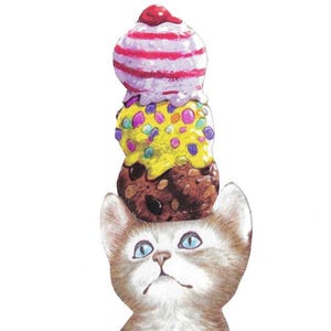 May include: A whimsical illustration of a kitten with blue eyes, brown and white fur, and a three-scoop ice cream cone balanced on its head. The ice cream has a cherry on top and colorful sprinkles.