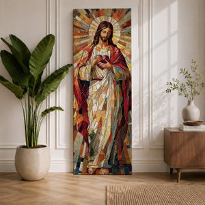 Long vertical stained glass style painting of Jesus Christ holding the Sacred Heart at his chest while radiant golden rays form a halo behind him. The figure is composed of colorful mosaic glass segments in red gold blue and white creating a luminous Christian devotional composition.
