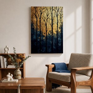 A framed vintage-style artwork depicting tall, bare trees in a forest with a textured golden background. The composition highlights the silhouette of woodland trees against a warm, aged backdrop, blending natural landscape elements with a nostalgic vintage aesthetic.