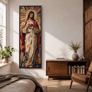 Long vertical stained glass style painting of Jesus Christ holding the Sacred Heart at his chest while radiant golden rays form a halo behind him. The figure is composed of colorful mosaic glass segments in red gold blue and white creating a luminous Christian devotional composition.