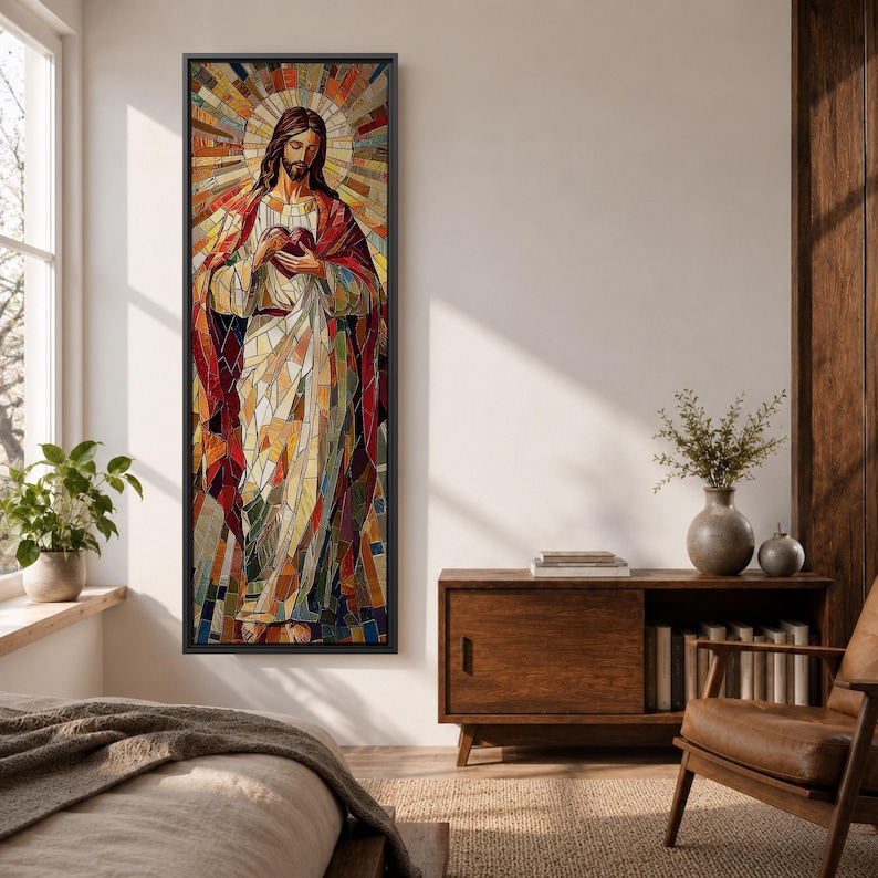 Long vertical stained glass style painting of Jesus Christ holding the Sacred Heart at his chest while radiant golden rays form a halo behind him. The figure is composed of colorful mosaic glass segments in red gold blue and white creating a luminous Christian devotional composition.