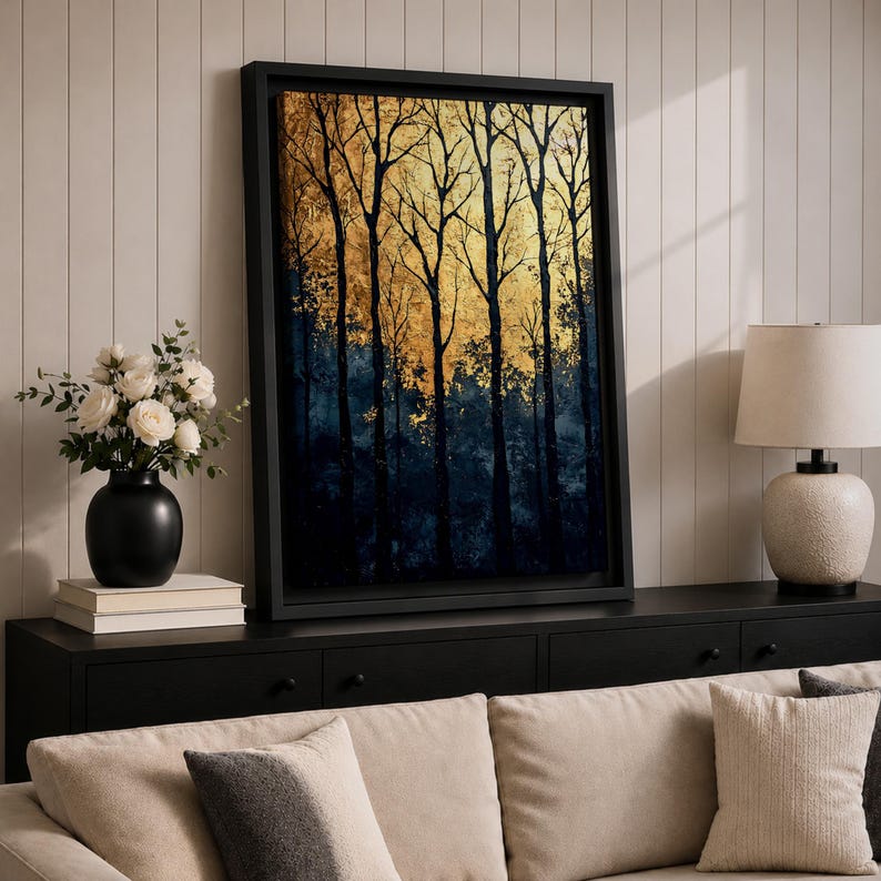 A framed vintage-style artwork depicting tall, bare trees in a forest with a textured golden background. The composition highlights the silhouette of woodland trees against a warm, aged backdrop, blending natural landscape elements with a nostalgic vintage aesthetic.