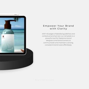 May include: A tablet computer displaying a bottle of body lotion with the text "LUMINOUS BODY LOTION" on the label. The bottle is on a beach with a blue sky and white clouds. The text "Empower Your Brand with Clarity" is displayed on the screen.
