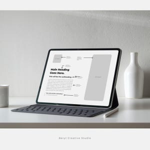 May include: A white tablet computer with a black keyboard and a white stylus. The screen displays a presentation template with the text "Main Heading Goes Here." and "This will be the subheading".
