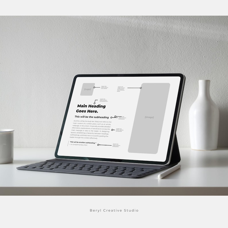 May include: A white tablet computer with a black keyboard and a white stylus. The screen displays a presentation template with the text "Main Heading Goes Here." and "This will be the subheading".