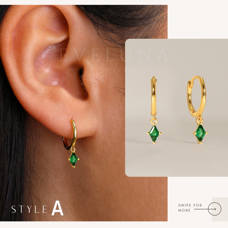 May include: Gold hoop earrings with a dangling green gemstone in a diamond shape. The earrings are shown on an ear and also displayed separately. The text "STYLE A" is visible.