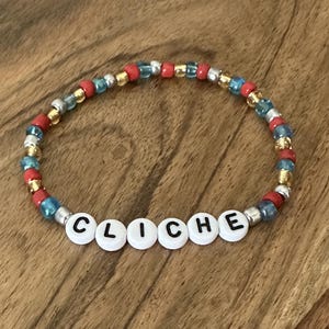 Cliche Glass Beaded Stretch Bracelet: Red Yellow Silver Blue