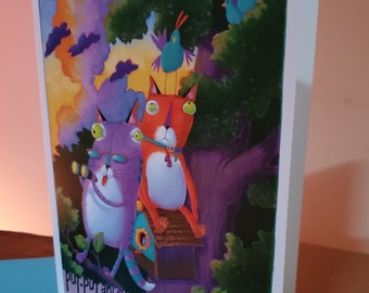 Könnte beinhalten: Eine farbenfrohe Illustration mit zwei Zeichentrickkatzen in einem Baum. Die lila Katze trägt eine Brille und hält eine Zigarre, die orange Katze sitzt auf einem Vogelhaus. Der Text "pur-pur and Steely Dan go Bird Watching" ist enthalten. Der Hintergrund zeigt Vögel und einen Sonnenuntergang.