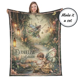 May include: A soft, green and brown fleece throw blanket with a whimsical fairy scene. The blanket features two fairies with wings, a stream, and glowing lanterns. The text "Evangeline Faith" is printed on the blanket.