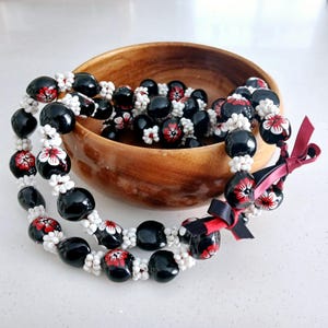 Black and Red Kukui Nut Lei with White Mongo Shells