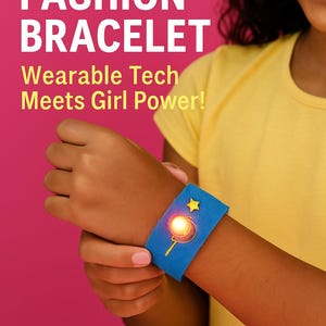 May include: A girl wearing a yellow shirt is shown wearing a blue light-up bracelet with a yellow star and a glowing light. The bracelet is made of felt and has a light-up circuit. The text "LIGHT-UP FASHION BRACELET" and "Wearable Tech Meets Girl Power!" is displayed above the girl.