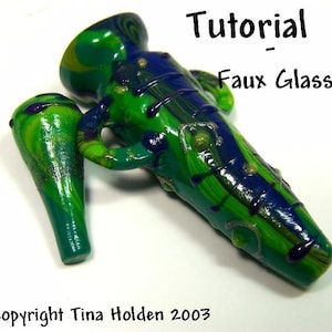 May include: A green and blue glass-like bottle with a swirl design and gold accents. The bottle has a small handle and a pointed end. The text "Tutorial - Faux Glass" is visible in the image.