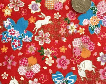Rabbits and cherry blossoms on red background, Japanese cotton fabric, sold by the half yard,