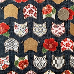 May include: Dark blue fabric featuring a repeating pattern of gold cat silhouettes, red flowers, and cat-shaped designs with floral and geometric patterns. A coin is visible in the image for scale.