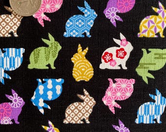 Colorful rabbit silhouettes with floral and Japanese pattern on black background, Japanese cotton dobby fabric, Sold by the half yard,