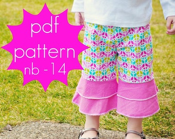 May include: Brightly coloured patterned trousers with a pink frilled hem. The trousers display a peace sign design in pink, green, and blue. The image also includes the text "pdf pattern nb-14" in a pink starburst.