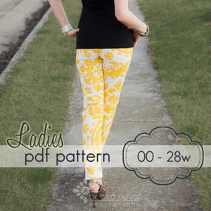 May include: White and yellow patterned trousers with a black top. The trousers have a floral design. The image includes the text "Ladies pdf pattern" and "00 - 28w". The person is walking on a pavement.