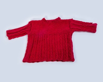 Hand-knitted sweater with cables