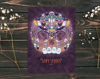 Stay spooky fun halloween skull card with drawings of candy corn, cauldrons, bones, snakes, gravestones. Cute halloween card for everyone