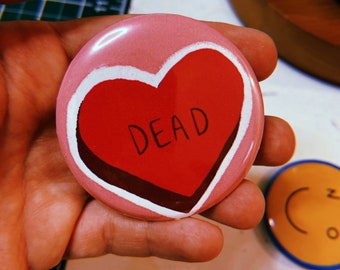 Pinback button with a red heart with &quot;dead&quot; written on it. Small, funny gift for a millennial or gen z teen