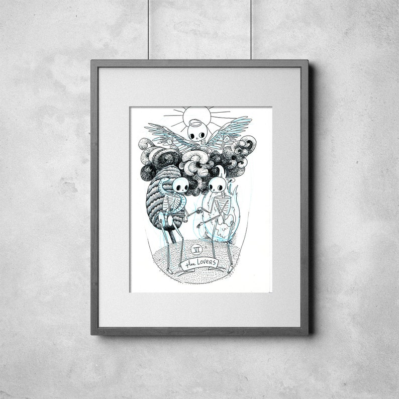May include: Framed black and white illustration of a tarot card, "The Lovers." The artwork features skeletal figures, a sun, and cloud-like formations. The image is in a gray frame.