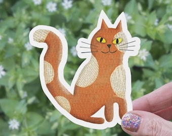 Orange Cat Matte Sticker: Smiling Kitty with Newsprint Patches