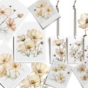 May include: A set of printable art featuring delicate white cosmos flowers with brown stems and leaves. The art is displayed in a variety of formats, including framed prints, postcards, and gift tags.