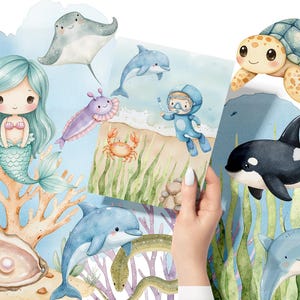 May include: Watercolor illustration of various sea creatures, including a mermaid, a dolphin, a stingray, a sea turtle, an orca, and a crab. The illustration is set against a blue background with coral and seaweed.