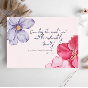 May include: A greeting card with watercolor flowers in shades of purple and pink. The card features the text "One day the word 'soon' will be replaced by 'finally'" and a Bible verse.