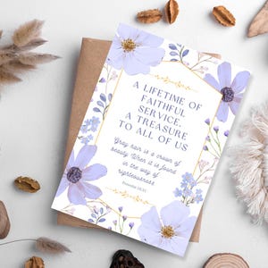May include: A greeting card with a floral design and the text "A Lifetime of Faithful Service. A Treasure to All of Us." The card features lavender flowers and a gold border. The card is on top of a brown envelope.