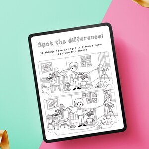May include: A black tablet displays a black and white "Spot the difference" puzzle. The puzzle shows two nearly identical illustrations of a boy's room with minor differences. Text at the top reads "Spot the difference!" and "10 things have changed in Simon's room. Can you find them?"
