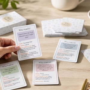 May include: A set of white game cards titled Who Said It? featuring colourful speech bubbles with biblical quotes, answers, scripture references, and bonus questions. The cards have a patterned back design with small icons and are displayed in a box.