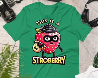 This is a Strobbery / Strawberry Shirt Pun Tee - Vibrant Berry Thief Graphic, Fruit Unisex T-Shirt, Fun Casual Summer Top, Foodie Gift Idea