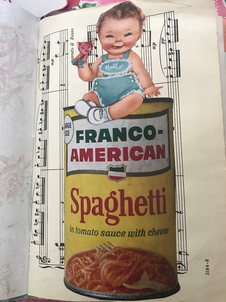 May include: A yellow can of Franco-American Spaghetti in tomato sauce with cheese. A baby wearing a blue and white outfit sits on top of the can, holding a pink toy.