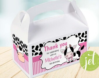 May include: White favor box with a pink and black cow print design. The box has a handle and says "Thank you for celebrating with us Michelle's 5th Birthday".