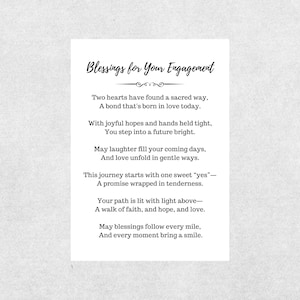 May include: A white card with the text "Blessings for Your Engagement" in elegant script. The card contains a poem about love, hope, and a future together, perfect for an engagement celebration.