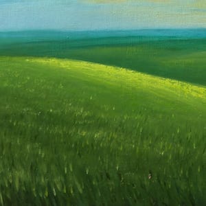 May include: An oil painting depicts a vibrant green field under a light blue sky. The grassy landscape features rolling hills, with sunlight illuminating the crests and casting shadows. The artwork evokes a sense of tranquility.