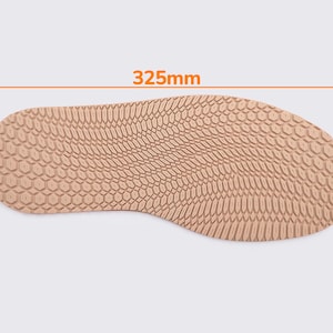 May include: A tan-colored shoe sole with a textured surface. The sole measures 12.8 inches long and 5.1 inches wide. The sole's thickness is 3.8 inches. The measurements are displayed in millimeters.
