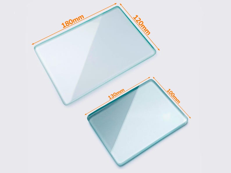 May include: Two rectangular glass plates, one measuring 180mm x 120mm and the other 130mm x 100mm. The plates are transparent with rounded corners, and are displayed against a light background. The dimensions are clearly labeled.