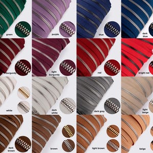 May include: A collection of zipper tapes in various colors, including green, purple, blue, dark blue, burgundy, light burgundy, red, bright red, white, dark white, dark gray, light beige, dark brown, brown, light brown, and beige. The zipper tapes are arranged in rows and columns, with each tape having a silver zipper pull.